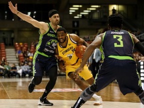 Edmonton Stingers' Adika Peter-McNeally (14) battles Niagara River Lions' Nem Mitrovic (21) in the second half of CEBL action at Edmonton Expo Centre in Edmonton, on Friday, June 28, 2019.