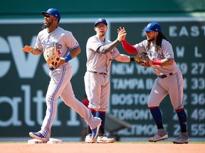 Teoscar Hernandez #37 celebrates with teammates Eric Sogard #5 and Freddy Galvis #16 of the Toronto Blue Jays after defeating the Boston Red Sox at Fenway Park on June 23, 2019 in Boston, Massachusetts. (Photo by Kathryn Riley/Getty Images)