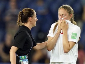 Canada's forward Janine Beckie (R) cries at the end of the France 2019 Women's World Cup round of sixteen football match between Sweden and Canada, on June 24, 2019, at the Parc des Princes stadium in Paris.