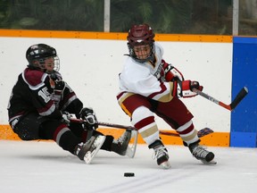 Monday July 9, 2007 / RUSHHOUR SPORTS 

Edmonton, AB: July 8, 2007:     The Brick 18th annual invitational super novice hockey tournament in Edmonton, AB, Sunday. Minnesto Blades vs Vancouver Vipers. Minneota  #15  Matthew Freytag takes a tumble after colliding with  Vancouvers Mathew Barzal.   Photo by Ryan Jackson/Edmonton Journal