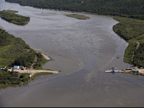 Crews work to clean up an oil spill on the North Saskatchewan river near Maidstone, Sask., on July 22, 2016. Husky Energy has pleaded guilty in a pipeline leak that sent oil spilling into a major river that is the source of drinking water for a number of Saskatchewan communities. The spill into the North Saskatchewan River in July 2016 forced the cities of North Battleford, Prince Albert and Melfort to shut off their water intakes for almost two months.
