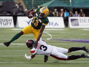 Edmonton Eskimos Ricky Collins Jr. eludes a tackle from Montreal Alouettes Patrick Levels during CFL game action in Edmonton on Friday June 14, 2019. (PHOTO BY LARRY WONG/POSTMEDIA)