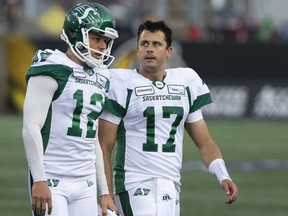 Saskatchewan Roughriders quarterback Zach Collaros looks toward Hamilton Tiger-Cats players as he leaves the field with an injury following a late hit during first half CFL football game action in Hamilton on June 13, 2019.
