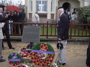 This picture shows the memorial plaque to the Queen's Own Rifles in front of Canada House at Juno Beach. (Gilbert Taylor photo)