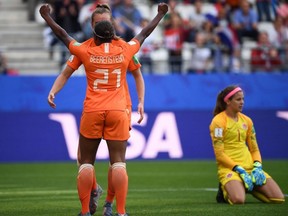Netherlands forward Lineth Beerensteyn (21) celebrates scoring her team's second goal as Canada's goalkeeper Stephanie Labbe (right) reacts during the Women's World Cup Group E match at the Auguste-Delaune Stadium in Reims, France, on June 20, 2019.