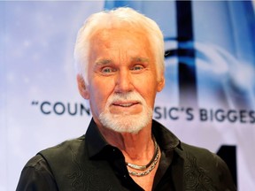 Kenny Rogers poses backstage after accepting the Willie Nelson Lifetime Achievement award at the 47th Country Music Association Awards in Nashville, Tennessee Nov . 6, 2013.