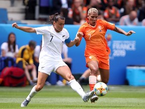 Ali Riley of New Zealand battles for possession with Shanice Van De Sanden of the Netherlands during the 2019 FIFA Women's World Cup France group E match between New Zealand and Netherlands at on June 11, 2019 in Le Havre, France.