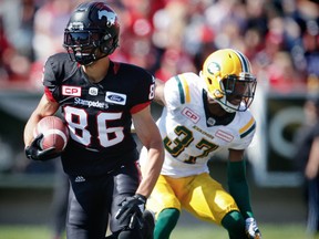 Calgary Stampeders receiver Anthony Parker avoids a tackle by Edmonton Eskimos linebacker Kenny Ladler in this file photo from Monday, Sept. 4, 2017.
