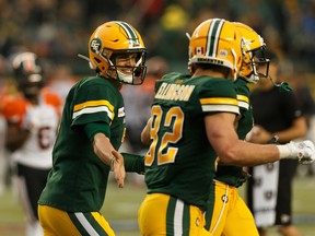 Edmonton Eskimos quarterback Trevor Harris (7) celebrates a touchdown with receiver Greg Ellingson (82) against the B.C. Lions during a CFL football game at Commonwealth Stadium in Edmonton, on Friday, June 21, 2019.