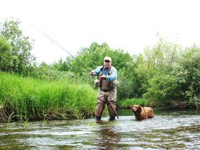 Neil and Penny on west central Alberta's famous spring creek, the North Raven River. Neil Waugh/Edmonton Sun