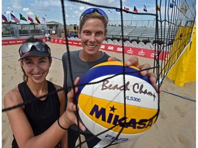 World champs, Canadians Sarah Pavan (R) and Melissa Humana-Paredes at the official kick-off of the FIVB Beach Volleyball World Tour with 90 teams representing 25 countries at the former Northlands Park Race Track in Edmonton, July 16, 2019.