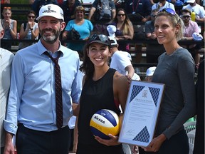 World champs, Canadians Sarah Pavan (R) and Melissa Humana-Paredes pose with Mayor Don Iveson at the official kick-off of the FIVB Beach Volleyball World Tour with 90 teams representing 25 countries at the former Northlands Park Race Track in Edmonton, July 16, 2019.