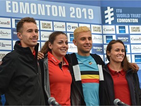 Posing for a photo at a news conference are, from left, Canadian triathlete Tyler Mislawchuk and Amelie Kretz, with Jelle Geens of Belguim and Taylor Spivey of the USA, competing Saturday in the ITU World Triathlon at Hawrelak Park in Edmonton, July 19, 2019.