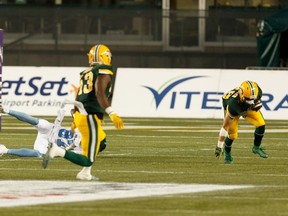 Edmonton Eskimos' Jordan Hoover (28) intercepts a pass to Toronto Argonauts' Derel Walker (87) during the second half of a CFL football game at Commonwealth Stadium in Edmonton, on Thursday, July 25, 2019. Photo by Ian Kucerak/Postmedia