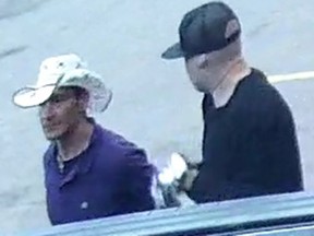 Edmonton police are seeking information regarding other suspects in relation to the remaining seven ATM incidents. Police are looking to identify two people seen in this surveillance image. (Supplied photo/EPS)