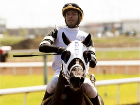 Jockey Rico Walcott after riding Shanghai Mike to victory at the Century Mile racetrack, in Edmonton Saturday July 13, 2019.