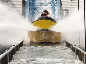 Riders keep cool at K-Days on the Niagara Falls log ride on a hot day where temperatures topped 32 degrees C in Edmonton on Tuesday, July 23, 2019.