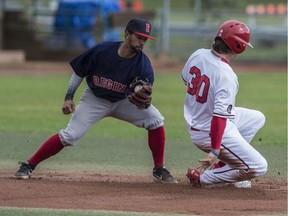 Nick Garcia of the Brooks Bombers steals second base as the throw comes too late to Adam De La Cruz of the Regina Red Sox at the WCBL All Star game at Re/Max field in Edmonton on Sunday, July 7, 2019.