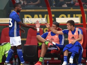 Cardiff City FC Junior Hollett (L) get high fives from teammates after coming off the pitch against Real Valladolif CF during a friendly match at Commonwealth Stadium in Edmonton, July 20, 2019.