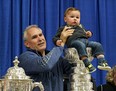 Calahoo resident Braxton Majeau, 13 months, poses for a photo with St. Louis Blues head coach Craig Berube in the hamlet of Calahoo northwest of Edmonton on Tuesday, July 2, 2019. Berube brought the Stanley Cup and the Campbell Conference Championship trophy to his home town after his team won the NHL Stanley Cup championship.