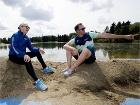 World Triathlon Edmonton president Sheila O'Kelly and World Triathlon Edmonton general manager Stephen Bourdeau are seen at the swimming starting line, as they prepare for next week's event, in Edmonton's Hawrelak Park, Sunday, July 14, 2019.