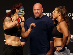 Cris Cyborg, left, and Felicia Spencer square off during UFC 240 weigh-ins at Rogers Place in Edmonton on Friday, July 26, 2019. They fight on Saturday.