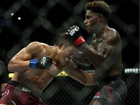 The Eskimos went to the UFC 240 event at Rexall Place on Saturday as a team-building exercise. Here, Hakeem Dawodu (right) defeated Yoshinori Horie (left) in a featherweight bout.