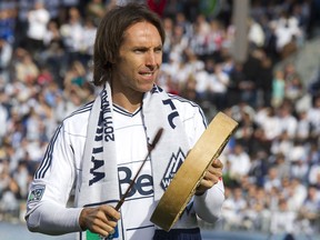 NBA star Steve Nash  of the Phoenix Suns and part owner of the Vancouver Whitecaps beats a drum before the match against Toronto FC March 19, 2011 in Vancouver, B.C.