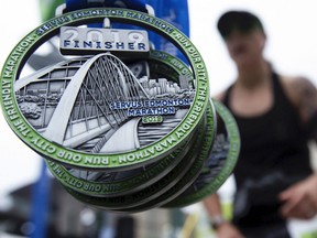 Runners finish the Servus Edmonton Marathon, Sunday Aug. 18, 2019.