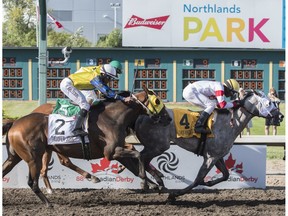 Jockey Rico Walcott  on Chief Know It All came up the middle to win at the 88th running of the Canadian Derby at Northlands park in Edmonton on Saturday Aug. 19, 2017.