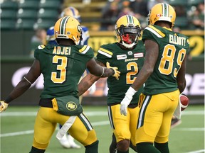 Edmonton Eskimos C.J. Gable (2) celebrates his touchdown with Natey Adjei (3) and Kevin Elliott (89) against the Winnipeg Blue Bombers during CFL action in the last game of the season at Commonwealth Stadium in Edmonton, November 3, 2018.
