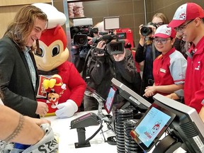 Edmonton's Jordan Haworth waited in line for 70 hours to be the first to order food from Phillipino fast-food giant Jollibee on Friday. The grand opening marked not only the first restaurant in Edmonton but in Alberta as well.