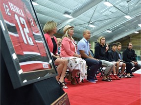 Retired NHLer Jarome Iginla (centre) with his family during a ceremony renaming the Akinsdale Arena to Jarome Iginla Arena in St. Albert. Known to fans as Iggy, he grew up in St. Albert and got his start in hockey playing for the St. Albert Eagle Raiders minor hockey team and played much of his 23-season career as the captain of the Calgary Flames, August 25, 2019. Ed Kaiser/Postmedia