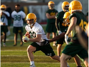 Running back Dryden Kalesnikoff runs the ball as the University of Alberta Golden Bears practice ahead of their Friday game against the Calgary Dinos at Foote Field in Edmonton, on Monday, Aug. 26, 2019.