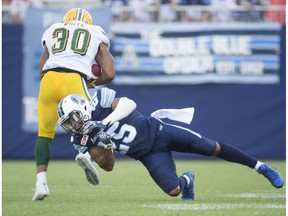 Toronto Argonauts Isaiah Green and Edmonton Eskimos John White during 1st half CFL action at BMO Field in Toronto, Ont. on Saturday August 20, 2016.