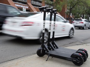 New Bird electric scooters parked along 109 Street north of Jasper Avenue, in Edmonton Friday Aug. 16, 2019. Photo by David Bloom