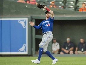 Blue Jays right fielder Derek Fisher gets hit in the face with a first inning fly ball against the Orioles at Oriole Park at Camden Yards in Baltimore on Saturday, Aug. 3, 2019.