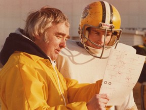 Alberta Golden Bears head coach Jim Donlevy and an unidentified player in November 1980.