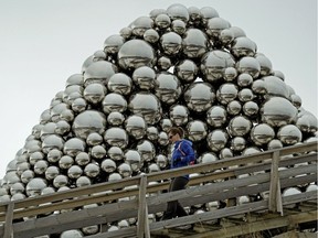 Marta Juhasz runs up and down the staircase beside a public art installation known as the Talus Dome, located beside the Quesnell Bridge near Fox Drive in southwest Edmonton on Thursday November 22, 2018.