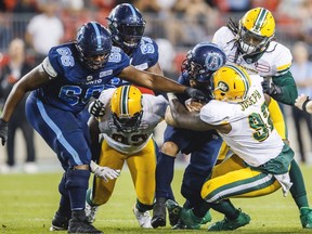 Toronto Argonauts quarterback McLeod Bethel-Thompson is sacked by Edmonton Eskimos' Jesse Joseph during the first half of CFL football action in Toronto, Friday August 16, 2019.