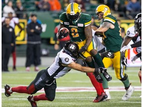 CP-Web.  Ottawa Redblacks' Antoine Pruneau (6) tackles Edmonton Eskimos' C.J. Gable (2) during first half CFL action in Edmonton on Friday, August 9, 2019.