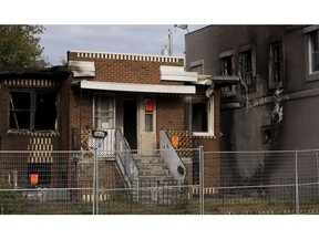 A home along 86 Street north of 112 Avenue following a fire in Edmonton on Saturday, Aug. 17, 2019.