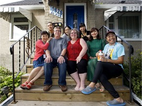 Barb Round and Jim Round pose for photos with members of the Gumbo Theatre Group, outside their home in Edmonton Wednesday Aug. 21, 2019. The theatre group from Osaka, Japan are billeting with the Round family. Photo by David Bloom