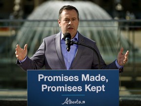 Alberta Premier Jason Kenney discusses the accomplishments of the UCP government in its first 100 days in office outside the Alberta legislature in Edmonton on Wednesday, Aug. 7, 2019.