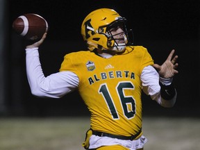 The University of Alberta Golden Bears quarterback Brad Launhardt makes a pass against the University of Manitoba Bisons during the third quarter at Foote Field, in Edmonton on Sept. 21, 2018.