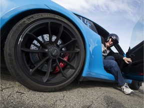 Allen Davey, 82, climbs out a Porsche 911 after racing around the Castro Raceway, in Edmonton Friday Aug. 23, 2019. Eight residents from the Touchmark seniors home got the chance to race around the track with the Track Junkies program. Photo by David Bloom