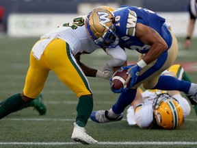 Winnipeg Blue Bombers receiver Nic Demski (right) pushes past Edmonton Eskimos defensive back Forrest Hightower for a touchdown during CFL action in Winnipeg on Thurs., June 27, 2019. Kevin King/Winnipeg Sun/Postmedia Network