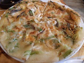 The seafood pancake - basically green onion cake served pizza-style - was greasy but tasty.