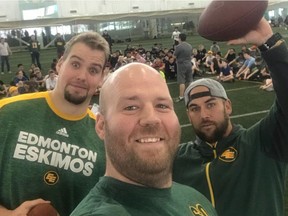 Edmonton Eskimos players Matt O'Donnell, Justin Sorensen and Ryan King participate in a flag football clinic for junior high school students at the Commonwealth Stadium fieldhouse on Thursday, March 15, 2018.