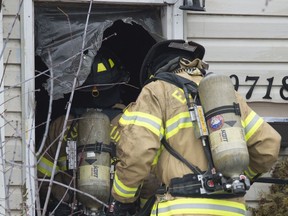 Firefighters doused a fire on the main floor of a boarded up house along 149 Street just north of 107 Avenue on Feb. 19, 2017. No injuries were reported and a fire recently destroyed a garage at the same property.  Photo by Shaughn Butts / Postmedia